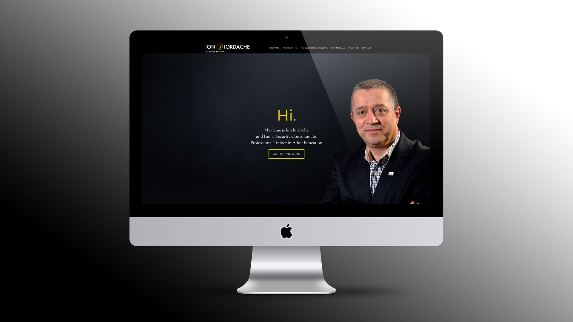 This PixelUp illustration showcases an iMac set against a dark grey linear gradient backdrop. On the screen, Ion Iordache's website homepage is displayed, featuring his portrait photo against a black background. Gold headlines and messages stand out against the dark backdrop. Ion Iordache's brand identity is among PixelUp's portfolio.